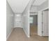 Entryway with tiled flooring, front door, and view into another room with neutral carpet at 12712 Dusty Trail Dr, Sarasota, FL 34238