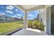 Back porch with view of fenced yard and landscaping at 12728 Lateral Root Dr, Sarasota, FL 34238