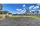 View of the backyard landscaping and fence at 12728 Lateral Root Dr, Sarasota, FL 34238
