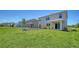 Backyard view of the grass and landscaping at 12728 Lateral Root Dr, Sarasota, FL 34238