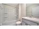 Bathroom featuring a shower-tub combo and vanity with storage at 12728 Lateral Root Dr, Sarasota, FL 34238