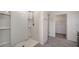 Shower with white tile and door to walk-in closet in modern bathroom at 12728 Lateral Root Dr, Sarasota, FL 34238