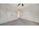 Bedroom with carpet, ceiling fan, and closet at 12728 Lateral Root Dr, Sarasota, FL 34238