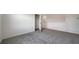 Clean carpeted bedroom flows into the closet at 12728 Lateral Root Dr, Sarasota, FL 34238