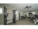 Well-equipped community fitness center with weight machines and views from large windows at 12728 Lateral Root Dr, Sarasota, FL 34238