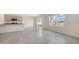 Open floor plan with tile flooring and large windows for natural light at 12728 Lateral Root Dr, Sarasota, FL 34238