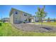 A freshly mulched and grassy backyard with a young tree at 12732 Lateral Root Dr, Sarasota, FL 34238