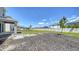 Spacious backyard with fresh mulch, green grass, and partial fence at 12732 Lateral Root Dr, Sarasota, FL 34238