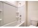 Clean, minimalist bathroom with white tiled shower and toilet at 12732 Lateral Root Dr, Sarasota, FL 34238