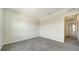 Minimalist bedroom with gray carpet and view to the hall at 12732 Lateral Root Dr, Sarasota, FL 34238