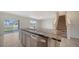 Kitchen island with granite countertops and stainless steel dishwasher, perfect for meal prep and entertaining at 12732 Lateral Root Dr, Sarasota, FL 34238