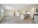Open living space with an eat-in kitchen, an island with granite countertops, and stainless-steel appliances at 12732 Lateral Root Dr, Sarasota, FL 34238
