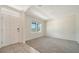 Bright living room with plush carpet, large windows, and neutral paint, ready for your personal touch at 12732 Lateral Root Dr, Sarasota, FL 34238
