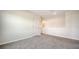 Upstairs loft area with neutral walls, recessed lighting, and gray carpeting at 12732 Lateral Root Dr, Sarasota, FL 34238