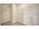 A view of a walk-in closet, featuring ample storage with wire shelving at 12732 Lateral Root Dr, Sarasota, FL 34238