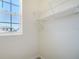 A walk-in closet featuring wire shelving and natural light from a window at 12732 Lateral Root Dr, Sarasota, FL 34238