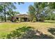 Large horse barn in expansive yard, perfect for an equestrian lifestyle at 13719 Seminole Trl, Wimauma, FL 33598