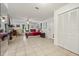 Bright main bedroom features a fireplace, ceiling fan, and closet for ample storage at 13719 Seminole Trl, Wimauma, FL 33598