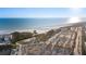 Stunning aerial shot of the beach, parking, and ocean, showcasing a well-planned and accessible coastal area at 138 Pearl Ave, Sarasota, FL 34243