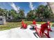 Expansive backyard featuring a concrete patio and lush greenery at 138 Pearl Ave, Sarasota, FL 34243
