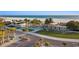 Well-maintained beach access with palm trees, modern structures, and a charming grassy area by the parking lot at 138 Pearl Ave, Sarasota, FL 34243