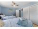 The bedroom features two beds with wooden frames, a door and a closet at 138 Pearl Ave, Sarasota, FL 34243
