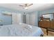 The bedroom features tile floors and a door to a white cabinet in the bathroom at 138 Pearl Ave, Sarasota, FL 34243