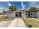 Charming home featuring a large driveway and attached garage at 138 Pearl Ave, Sarasota, FL 34243