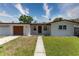 Charming single-story home featuring a well-maintained lawn and welcoming front porch, perfect for relaxed living at 138 Pearl Ave, Sarasota, FL 34243
