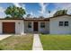 Well-maintained home exterior with covered porch and curb appeal at 138 Pearl Ave, Sarasota, FL 34243