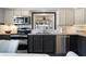Well-lit kitchen featuring stainless steel appliances and ample counter space, perfect for culinary enthusiasts at 138 Pearl Ave, Sarasota, FL 34243