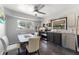 Stylish kitchen featuring stainless steel appliances, two-tone cabinetry, and ample natural light at 138 Pearl Ave, Sarasota, FL 34243