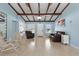 Bright living room featuring exposed beams and expansive windows, creating a welcoming atmosphere at 138 Pearl Ave, Sarasota, FL 34243