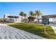 Scenic view of Siesta Public Beach showing building, covered picnic area, and palm trees, perfect for a beach outing at 138 Pearl Ave, Sarasota, FL 34243