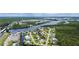 Expansive aerial view of a waterfront community with lush greenery and multiple waterways at 156 Myakka Rd, Venice, FL 34293