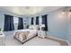 Tranquil bedroom with soft blue walls, plush bedding, and a large window offering natural light at 156 Myakka Rd, Venice, FL 34293
