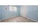 Light blue bedroom featuring tile flooring, closet with folding doors, and neutral trim at 156 Myakka Rd, Venice, FL 34293