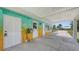Attached carport and exterior doors showcase ample parking and covered access with laundry hook ups at 156 Myakka Rd, Venice, FL 34293