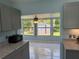 Kitchen featuring updated countertops, appliances, and tile backsplash at 156 Myakka Rd, Venice, FL 34293