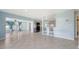 Open-concept design with a combined living and dining area, tiled floors and neutral paint at 156 Myakka Rd, Venice, FL 34293