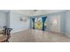 Bright living room with tiled floors, light blue walls, and a front door at 156 Myakka Rd, Venice, FL 34293