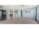 Open-concept living space with bar stool seating area, a kitchen and tiled floors at 156 Myakka Rd, Venice, FL 34293