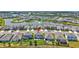 Aerial view of a home with a backyard, nearby pond and residential area at 17330 Harvest Moon Way, Bradenton, FL 34211