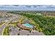 Aerial view of the community showcasing pools, ponds, golf course, and lush landscaping at 17330 Harvest Moon Way, Bradenton, FL 34211