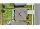 Bird's-eye view of a property with a well-maintained roof, fenced yard, and patio area at 17330 Harvest Moon Way, Bradenton, FL 34211