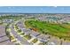 Beautiful aerial view of a home with a well-maintained lawn and manicured landscaping at 17330 Harvest Moon Way, Bradenton, FL 34211