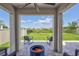 Back patio with fire pit with view of backyard at 17330 Harvest Moon Way, Bradenton, FL 34211