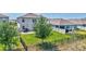 A home with a green lawn, mature trees, patio, and fencing at 17330 Harvest Moon Way, Bradenton, FL 34211
