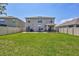Expansive backyard showcasing a patio, trampoline, and privacy fencing, creating a perfect outdoor oasis at 17330 Harvest Moon Way, Bradenton, FL 34211
