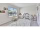 Bright bedroom featuring a large window and decorative storage at 17330 Harvest Moon Way, Bradenton, FL 34211
